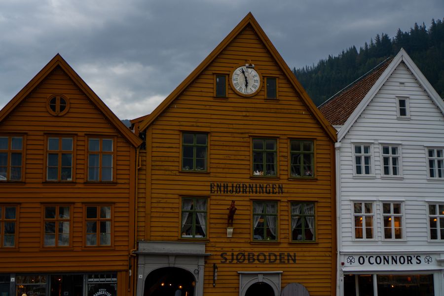 Old wooden harbour houses painted orange and white