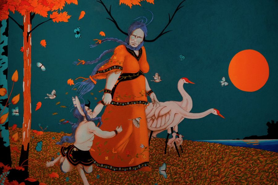 A colourful mural of a woman in orange with cranes and a red sun