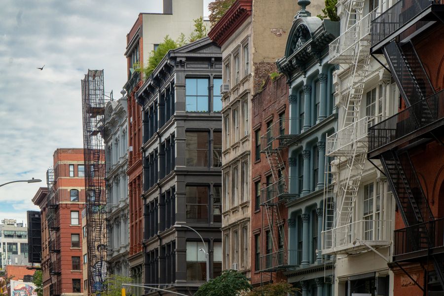 Cast-iron buildings and fire escapes along a downtown street