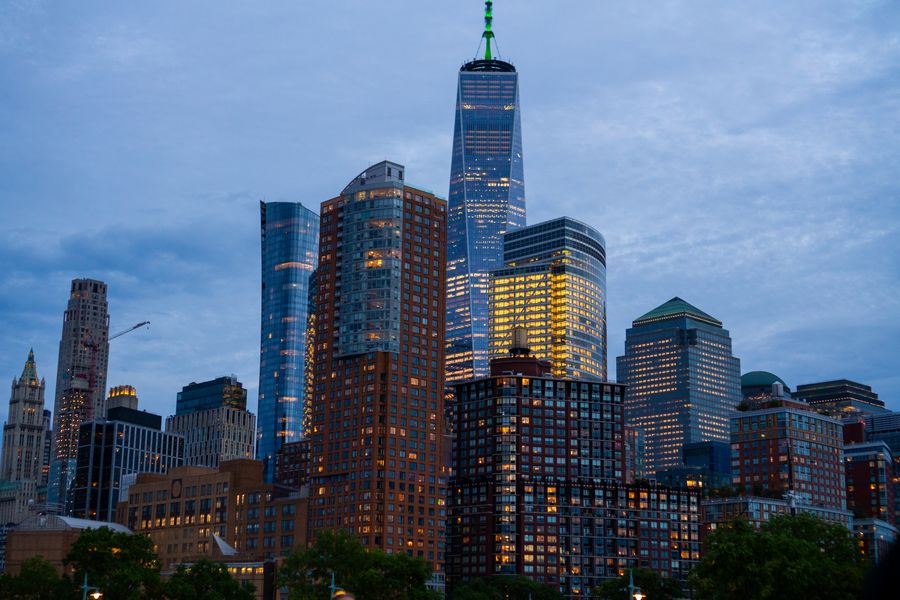 Downtown towers at dusk as the lights come on